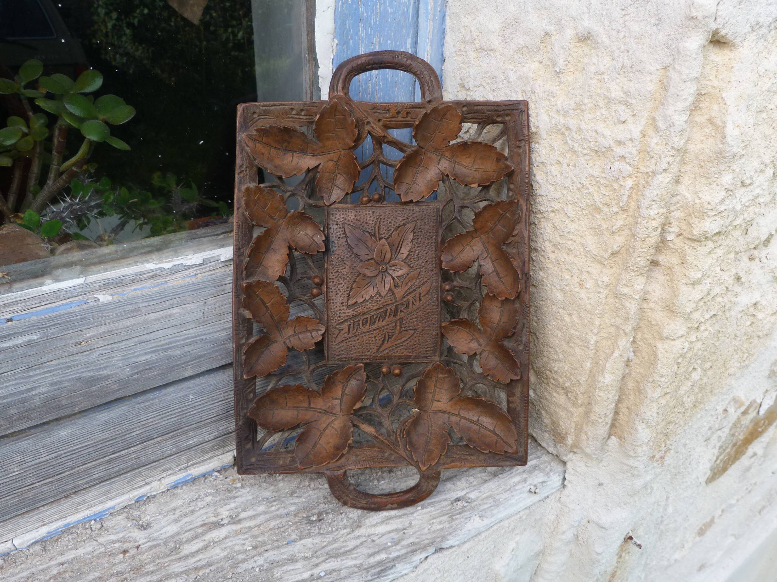 Small wooden tray cut out with leaf patterns
