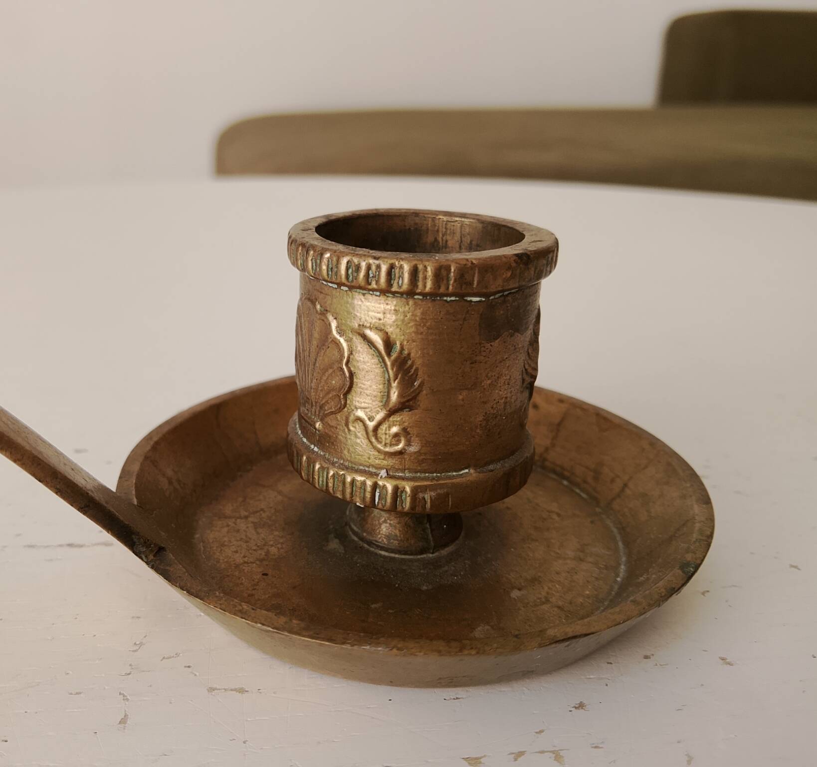 Antique hand-held candlestick in gilded bronze
