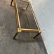 Gold metal coffee table with elm burl imitation.