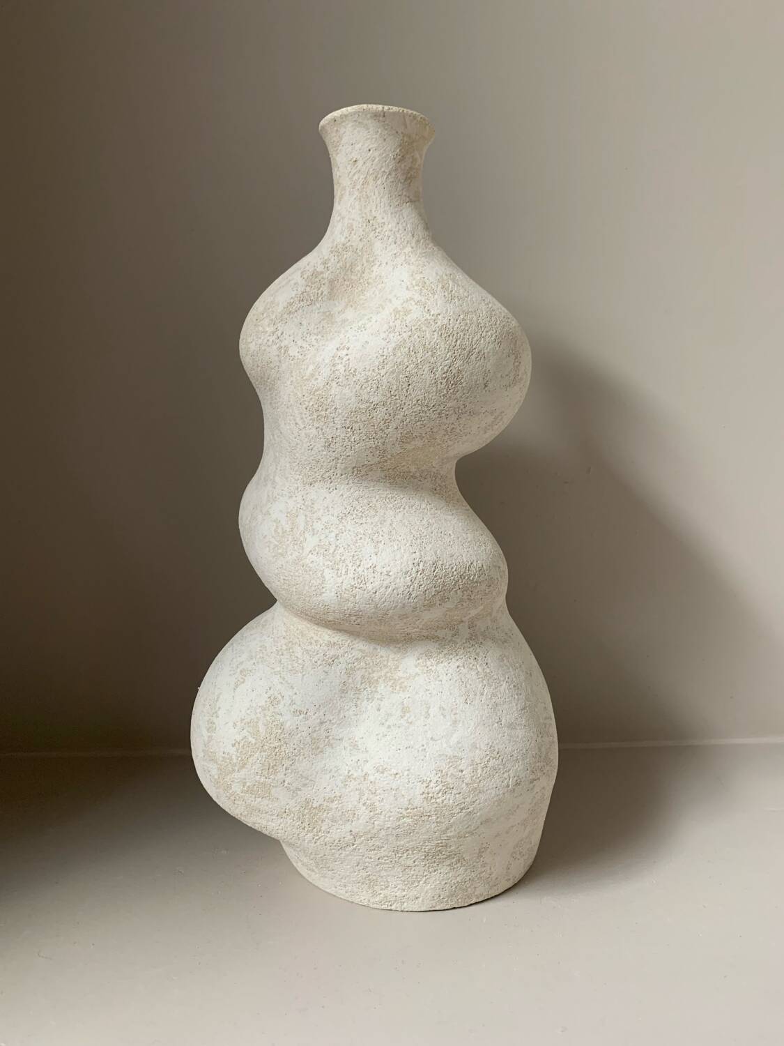 White stoneware vase in an organic shape