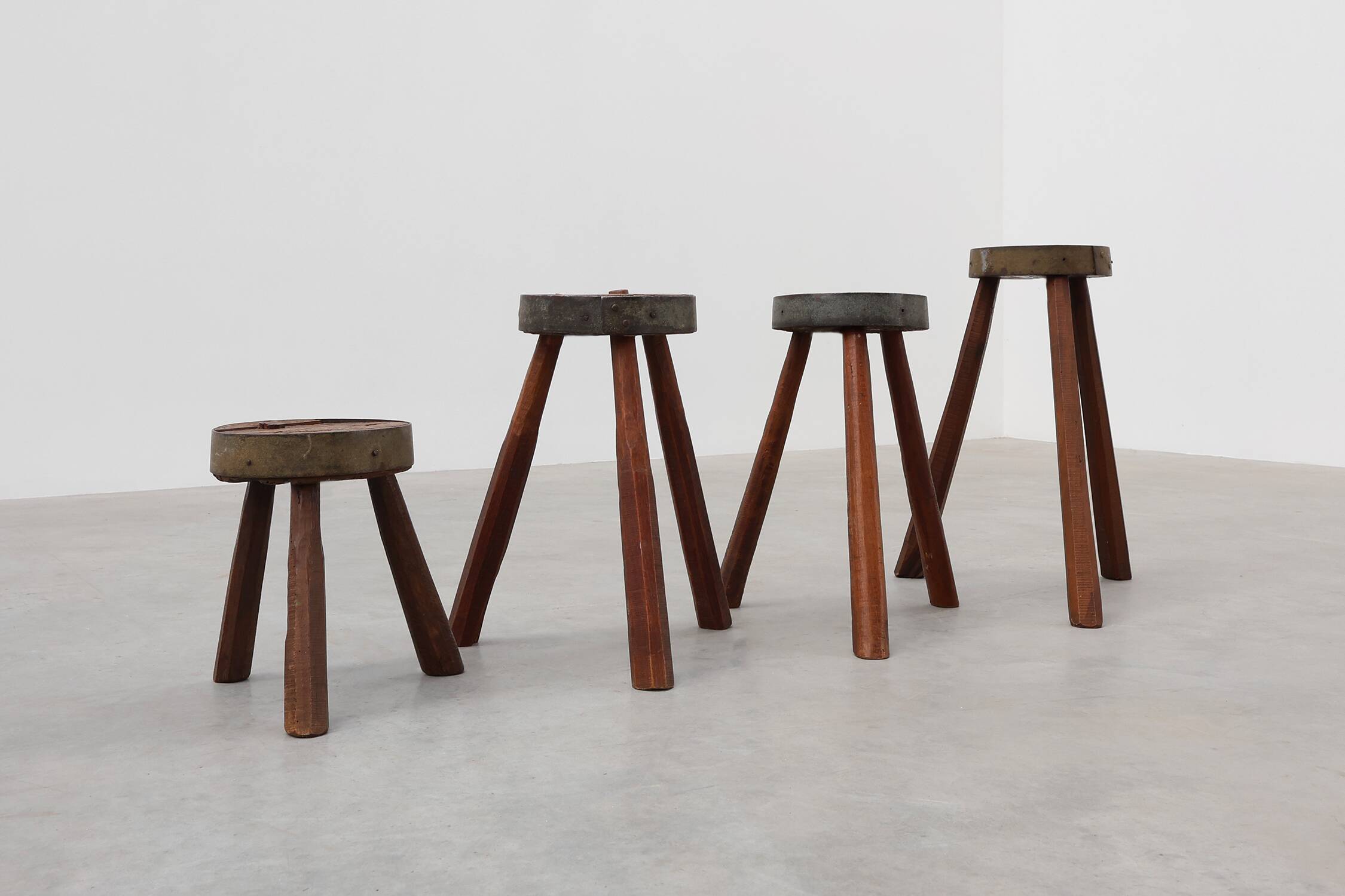 Brutalist French 1850s solid oak tripod stools with metal rim, set of 4