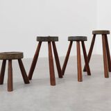 Brutalist French 1850s solid oak tripod stools with metal rim, set of 4