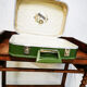 Green air hostess suitcase