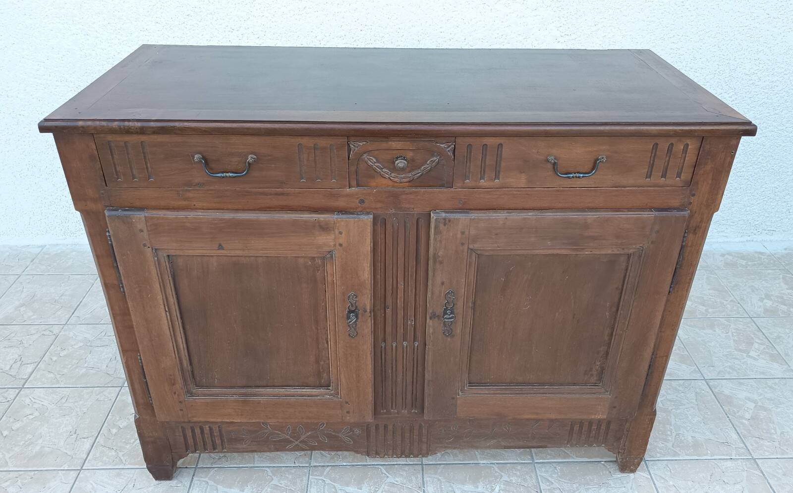 Louis XVI walnut buffet from the 19th century.