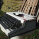 Revised typewriter and Olympia Traveller luxury with his satchel