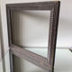 Antique wooden frame with geometric carvings light distress