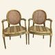 Pair of Louis XVI style armchairs, oval backrest and caning.