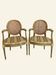 Pair of Louis XVI style armchairs, oval backrest and caning.