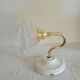 Brass flower and frosted glass sconce