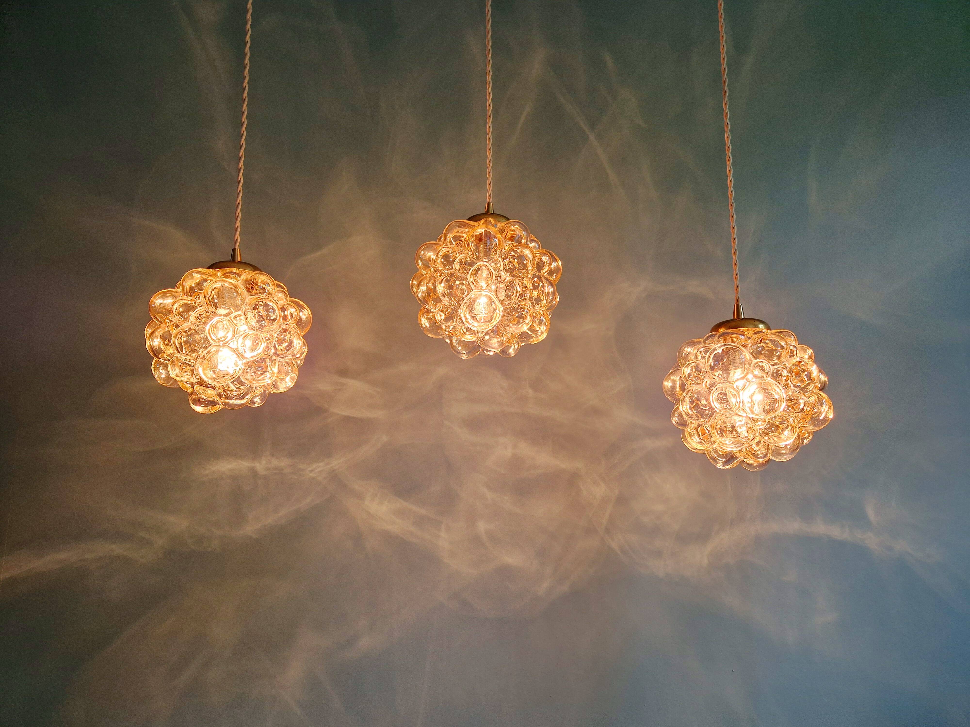 Amber bubble glass pendant (3 available), design by Helena Tynell, 1970.