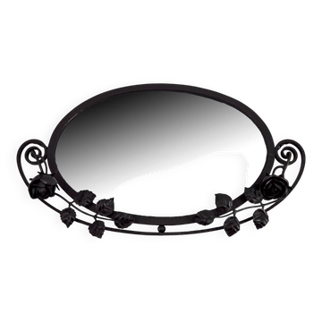 Art Deco wrought iron mirror with rose decoration, France, circa 1920.