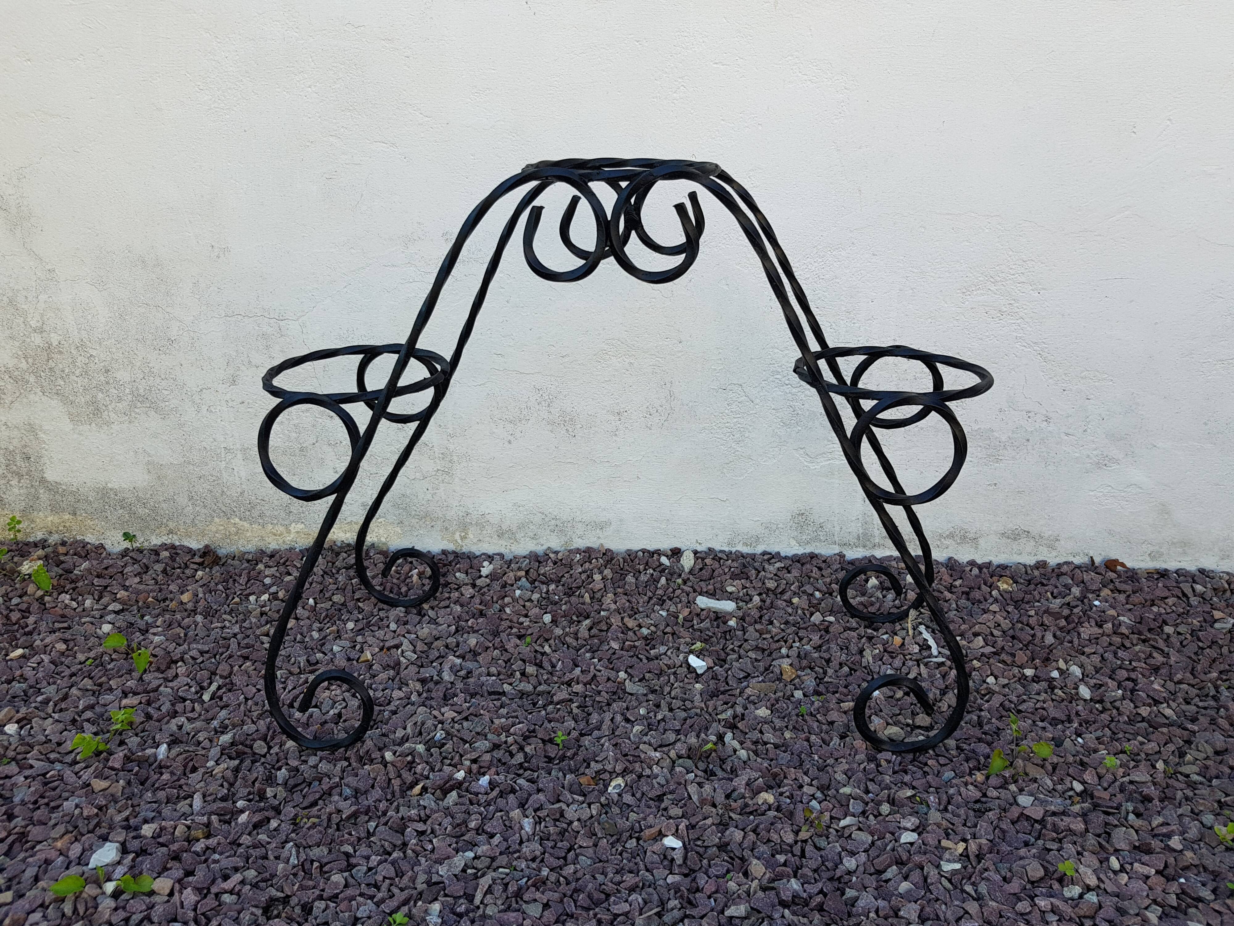 Black wrought iron plant holder