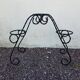 Black wrought iron plant holder