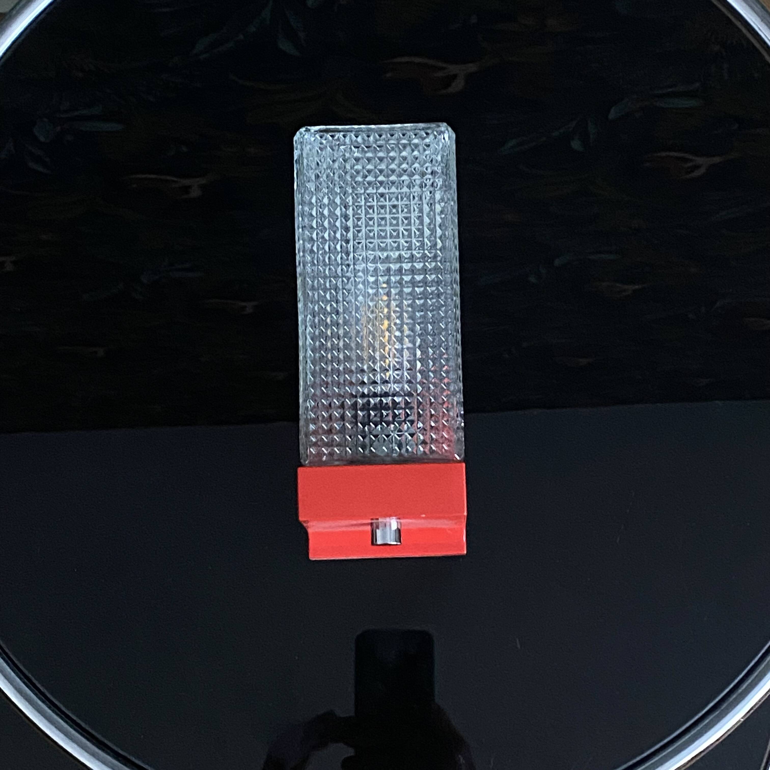 Pair of vintage wall lights in red plastic and clear glass