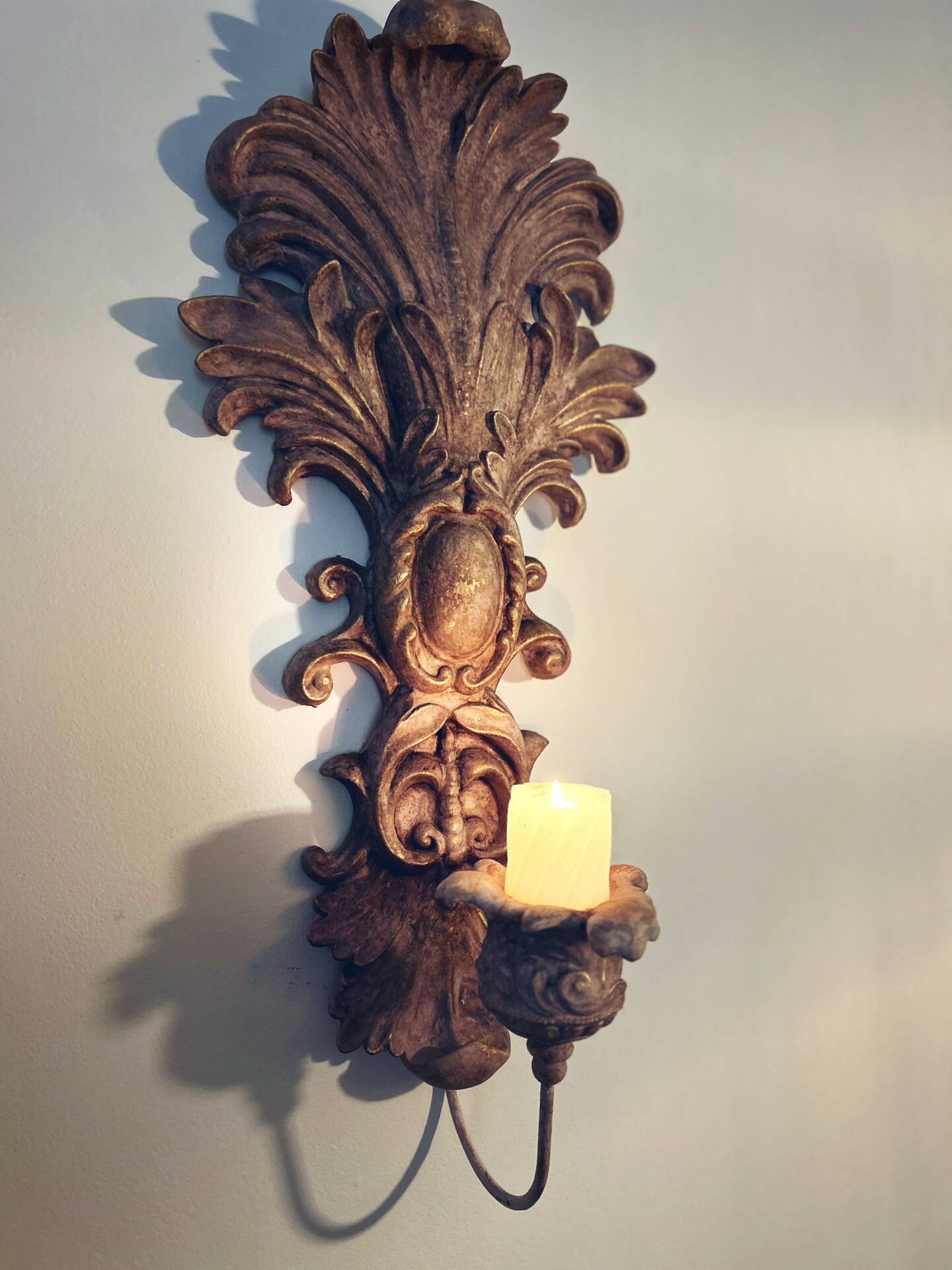 Incredible patinated wall candle holder