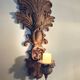 Incredible patinated wall candle holder