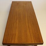 Table basse en teck avec feuille d'extension noire, design danois, années 1960.