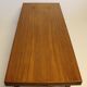 Table basse en teck avec feuille d'extension noire, design danois, années 1960.