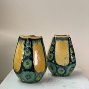 A pair of green and yellow vases