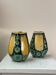 A pair of green and yellow vases