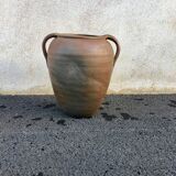 Old jug with two sandstone handles