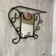 Wall-mounted coat rack with its mirror.