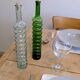 Pair of vintage ribbed blown glass bottles with cork stoppers.