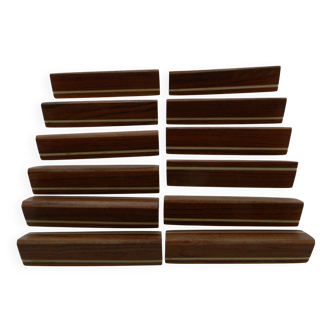 12 Art Deco knife rests made of rosewood with bone inlay.