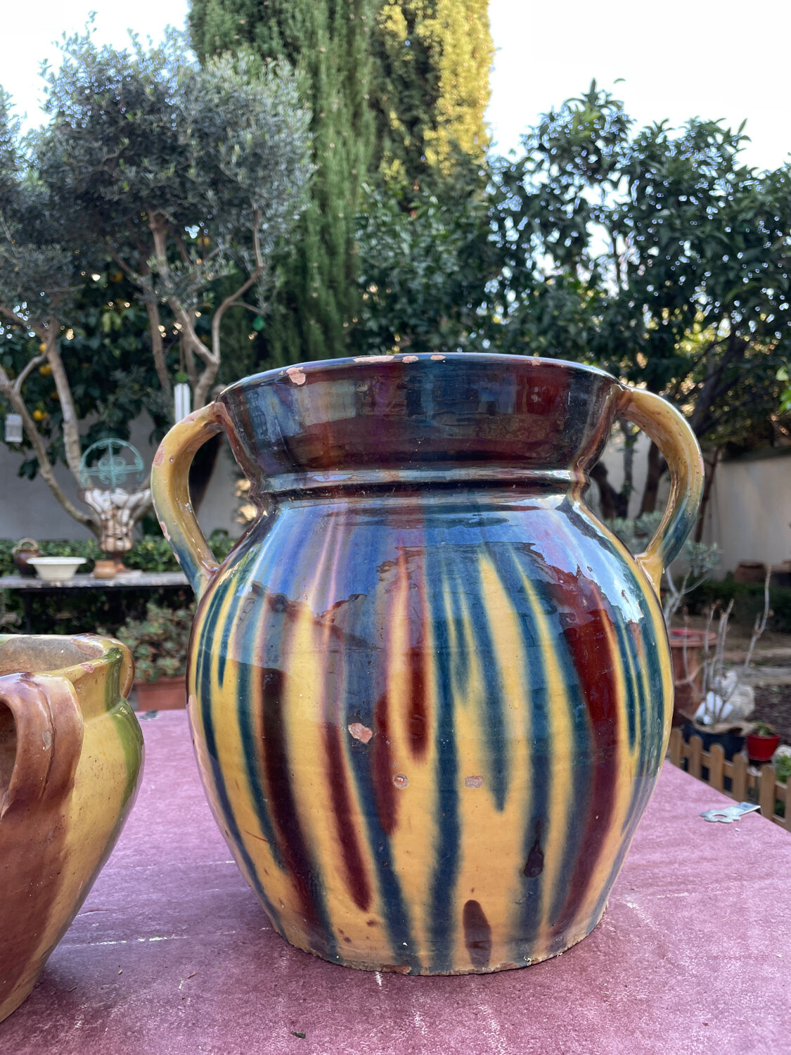 Old flower jar with two glazed earth handles