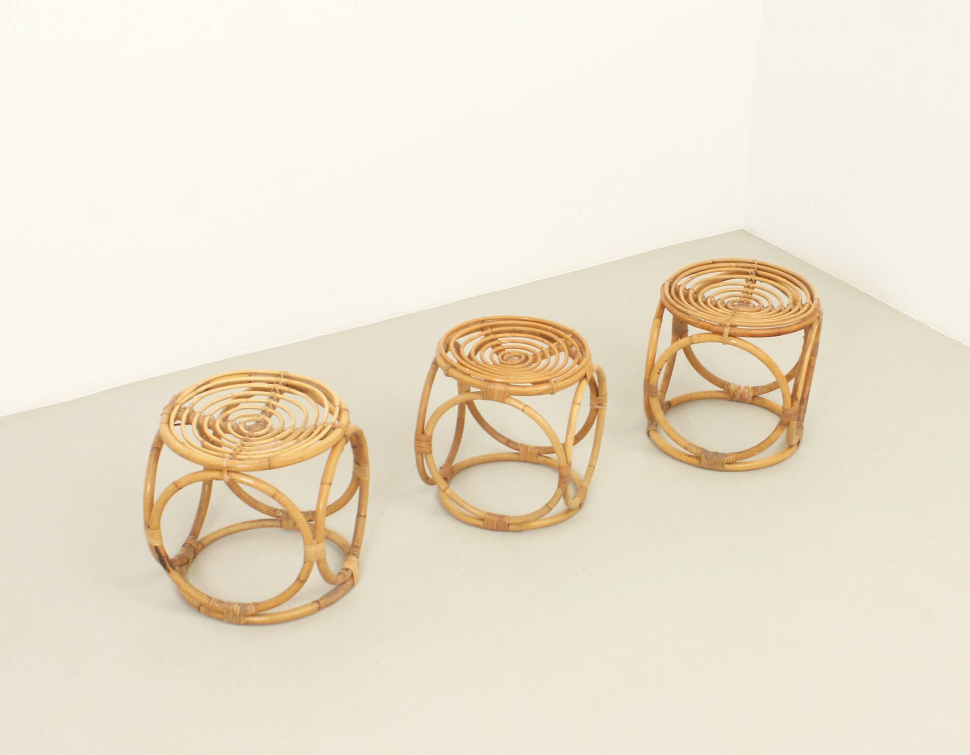 Set of three 1970s rattan stools, Spain.
