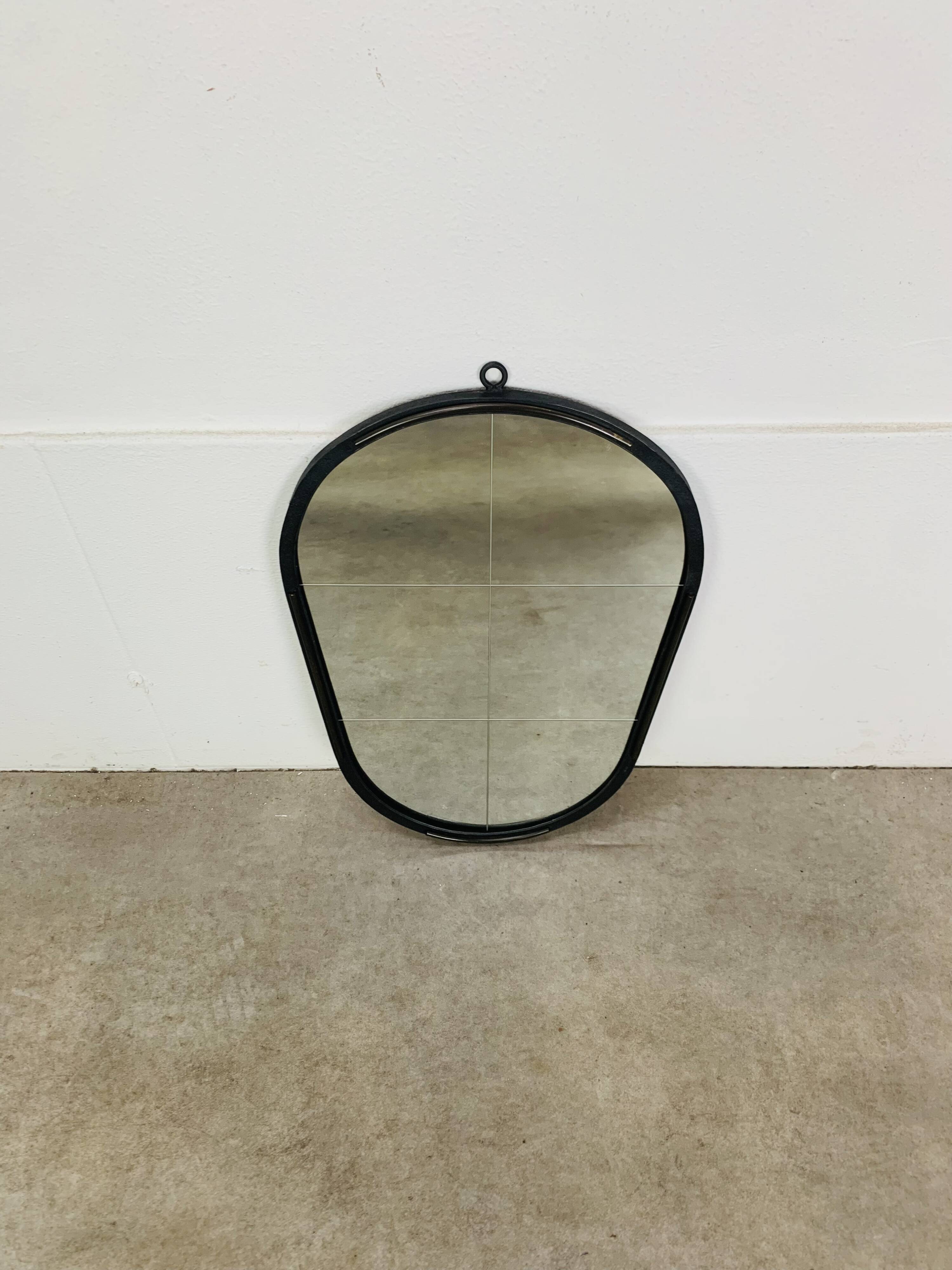 Oval mirror from the 1950s, wrought iron and brass.