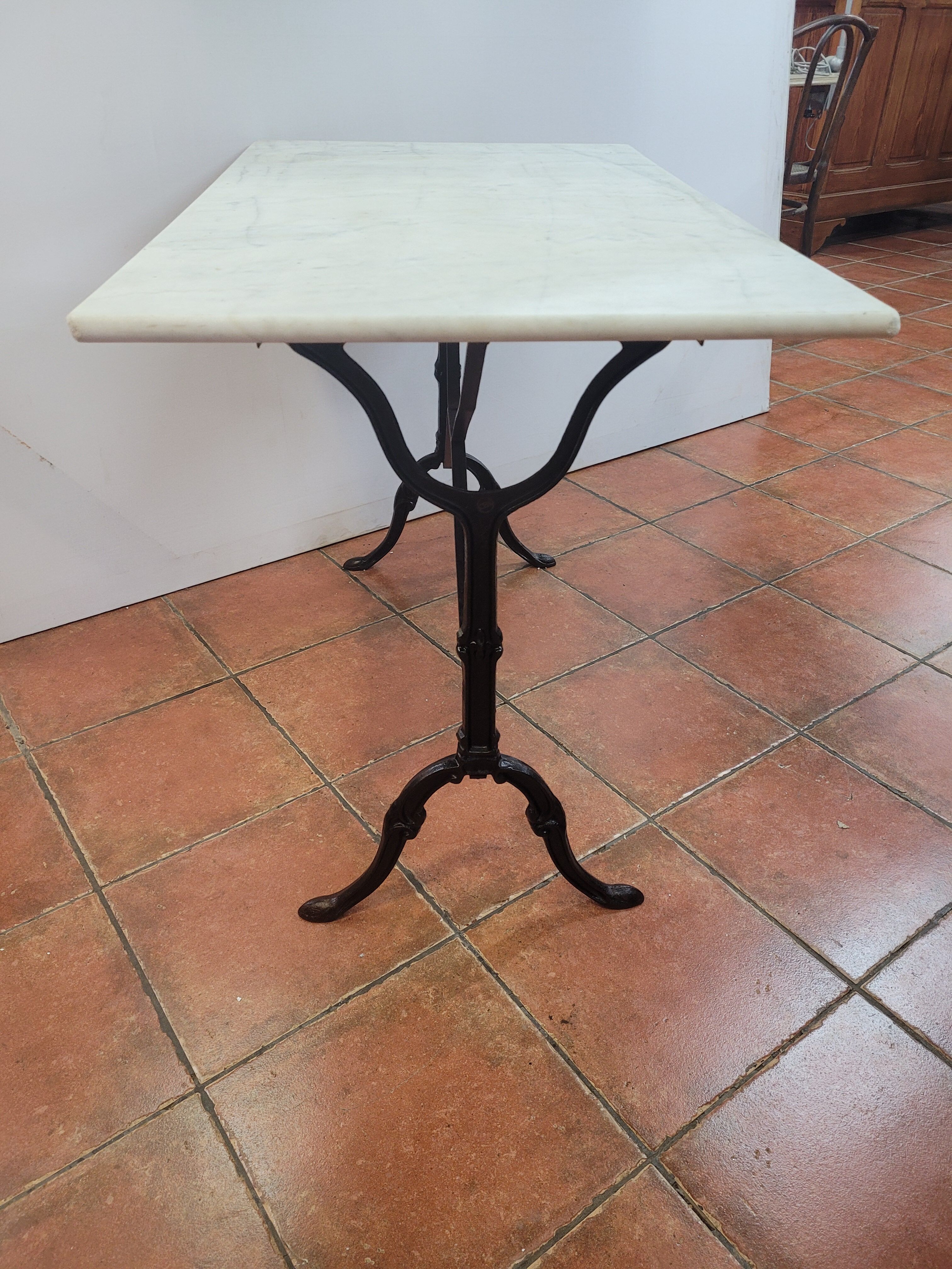 Bistro table base cast iron over marble