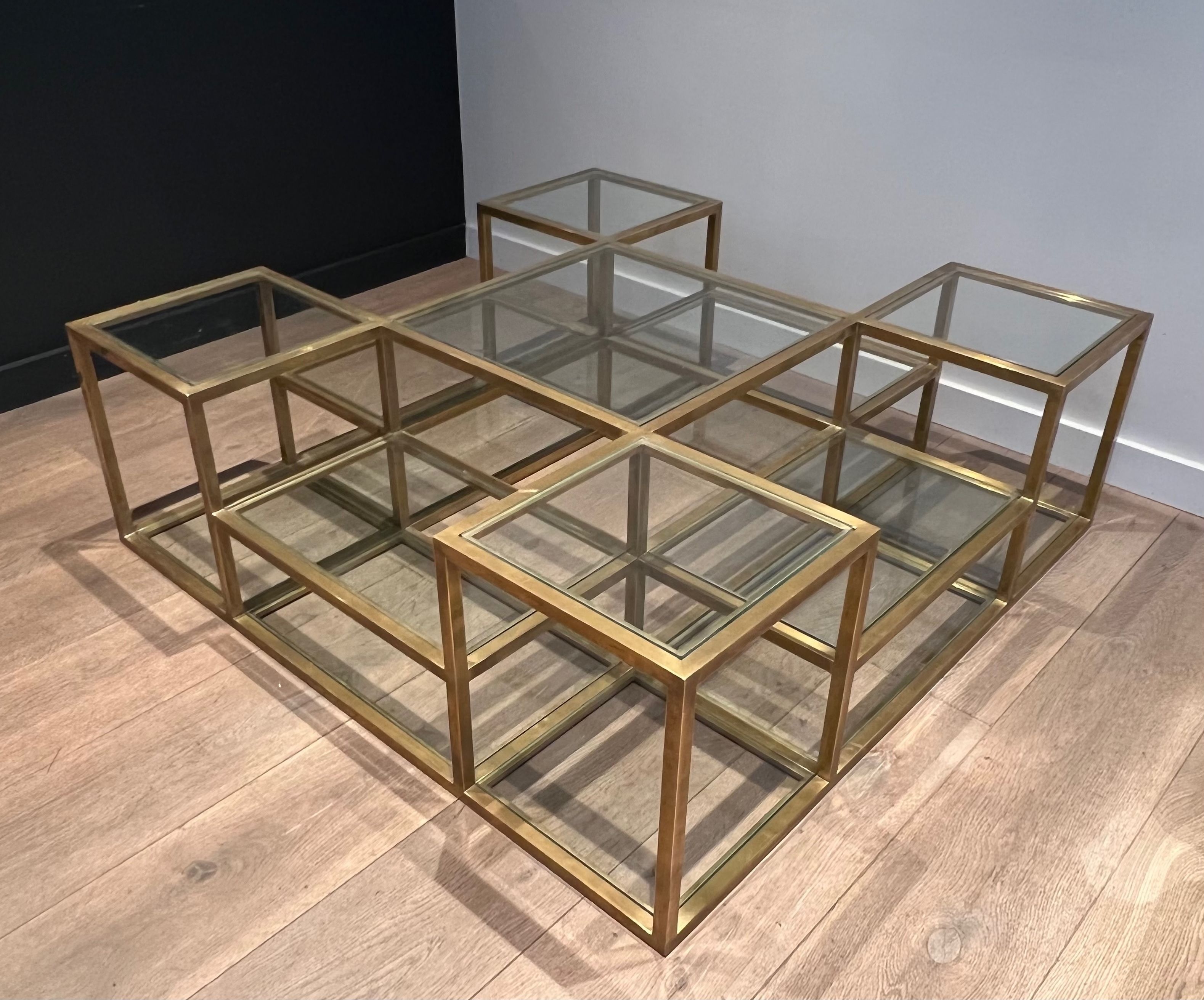 Important brass coffee table with multiple levels.