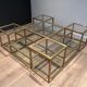 Important brass coffee table with multiple levels.