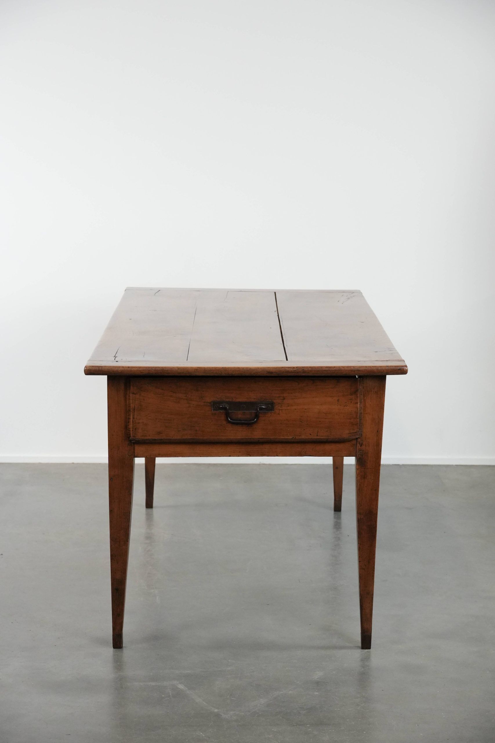 Elegant and subtle antique French dining table made of fruitwood