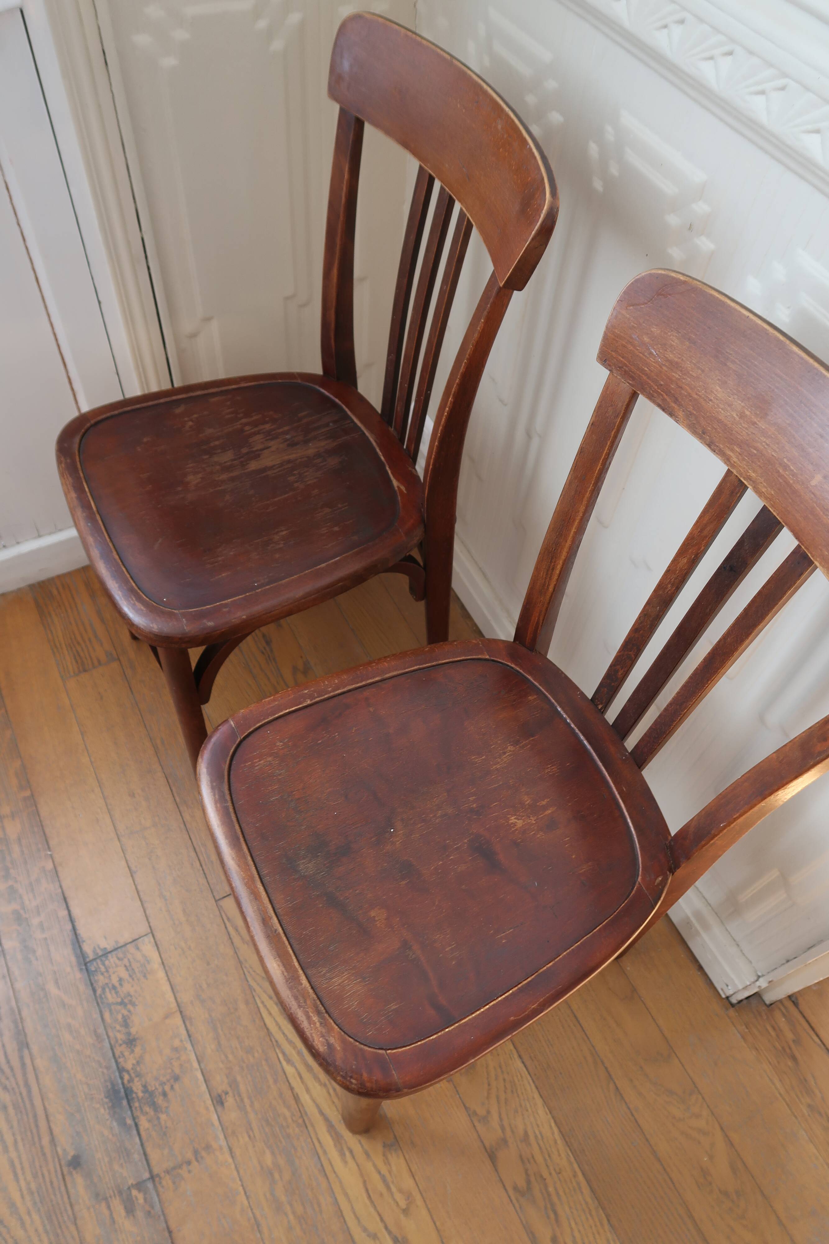 Pair of patinated bistro chairs