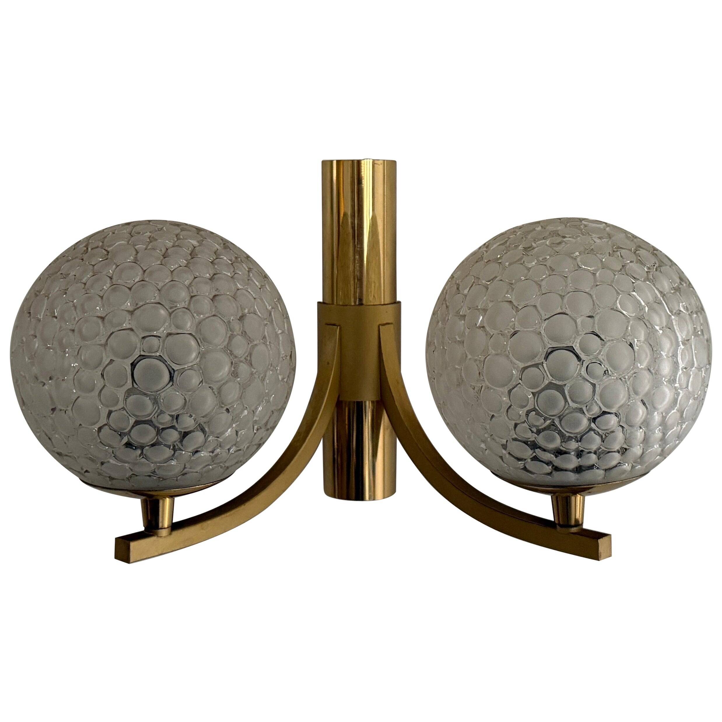 Simple two-armed wall light in brass and glass by Ball and Ball, Kaiser, 1960s, Germany.