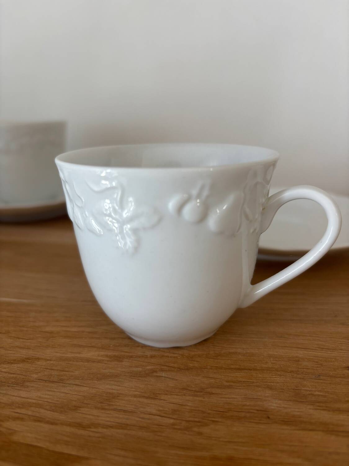 5 cups, 4 saucers and a creamer in Philippe Deshoulières porcelain