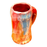 Traditional ceramic mug with a marbled glaze effect.