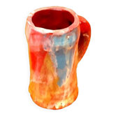 Traditional ceramic mug with a marbled glaze effect.