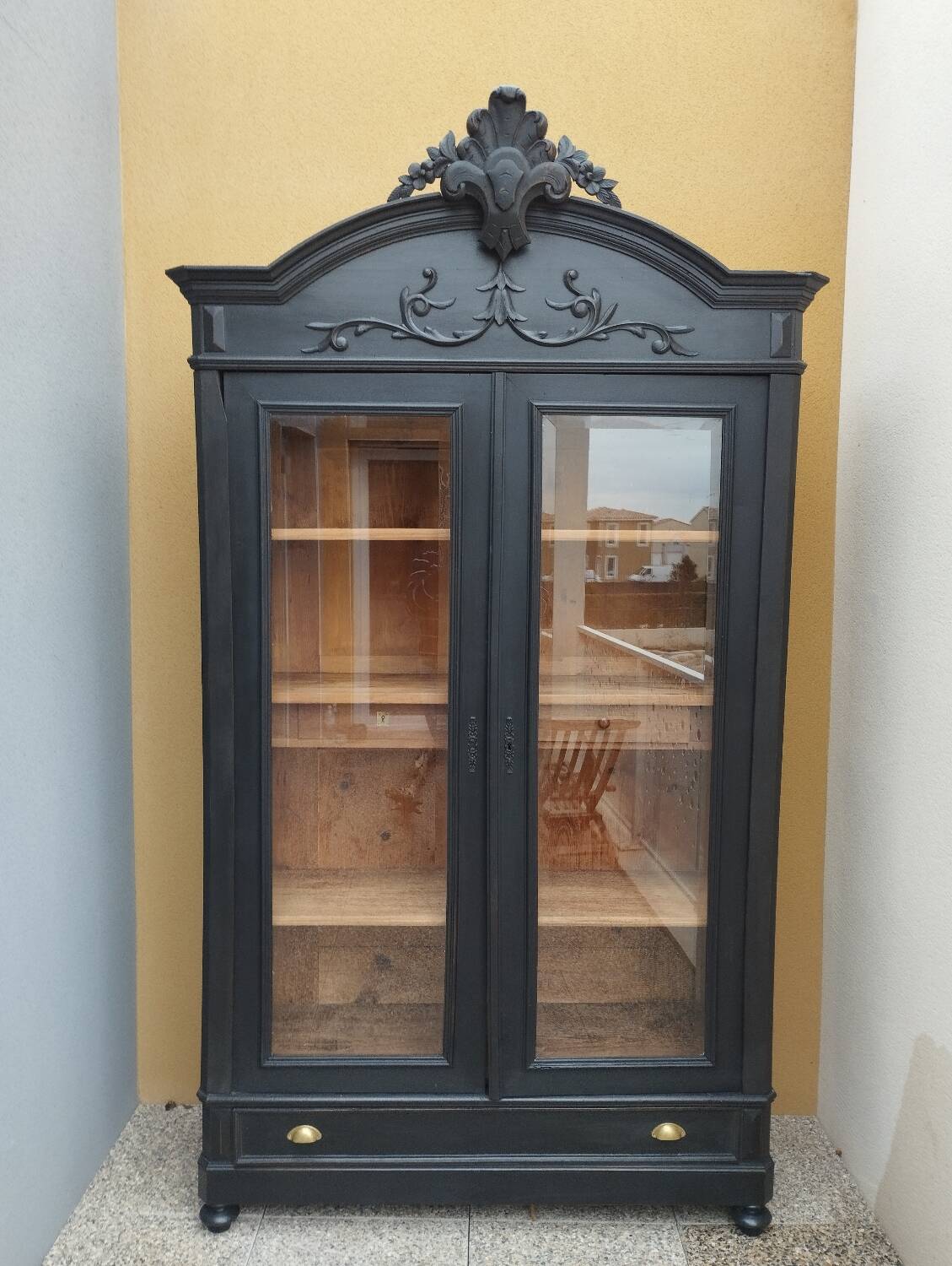 Bookcase black patina shell pediment 2 drawer doors