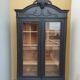 Bookcase black patina shell pediment 2 drawer doors