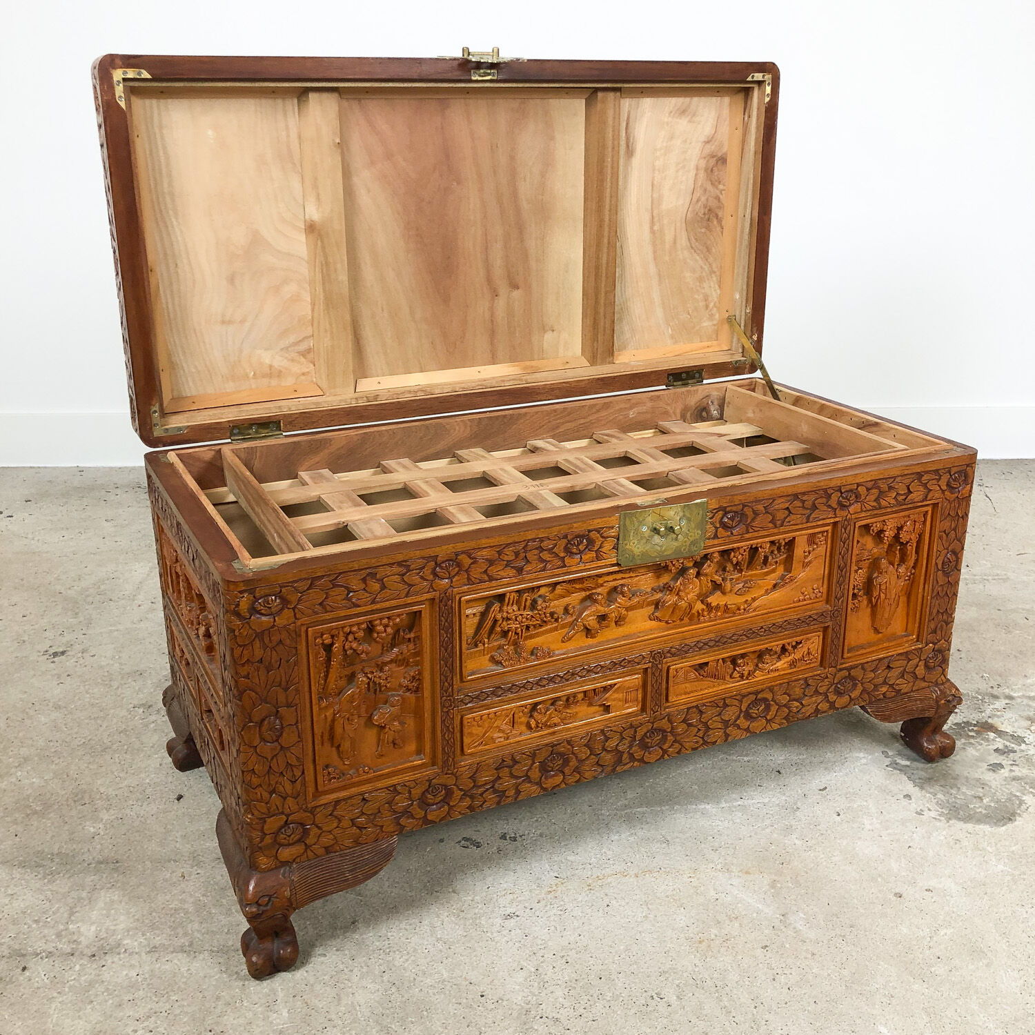 Vintage Chinese carved camphor wood chest on claw feet