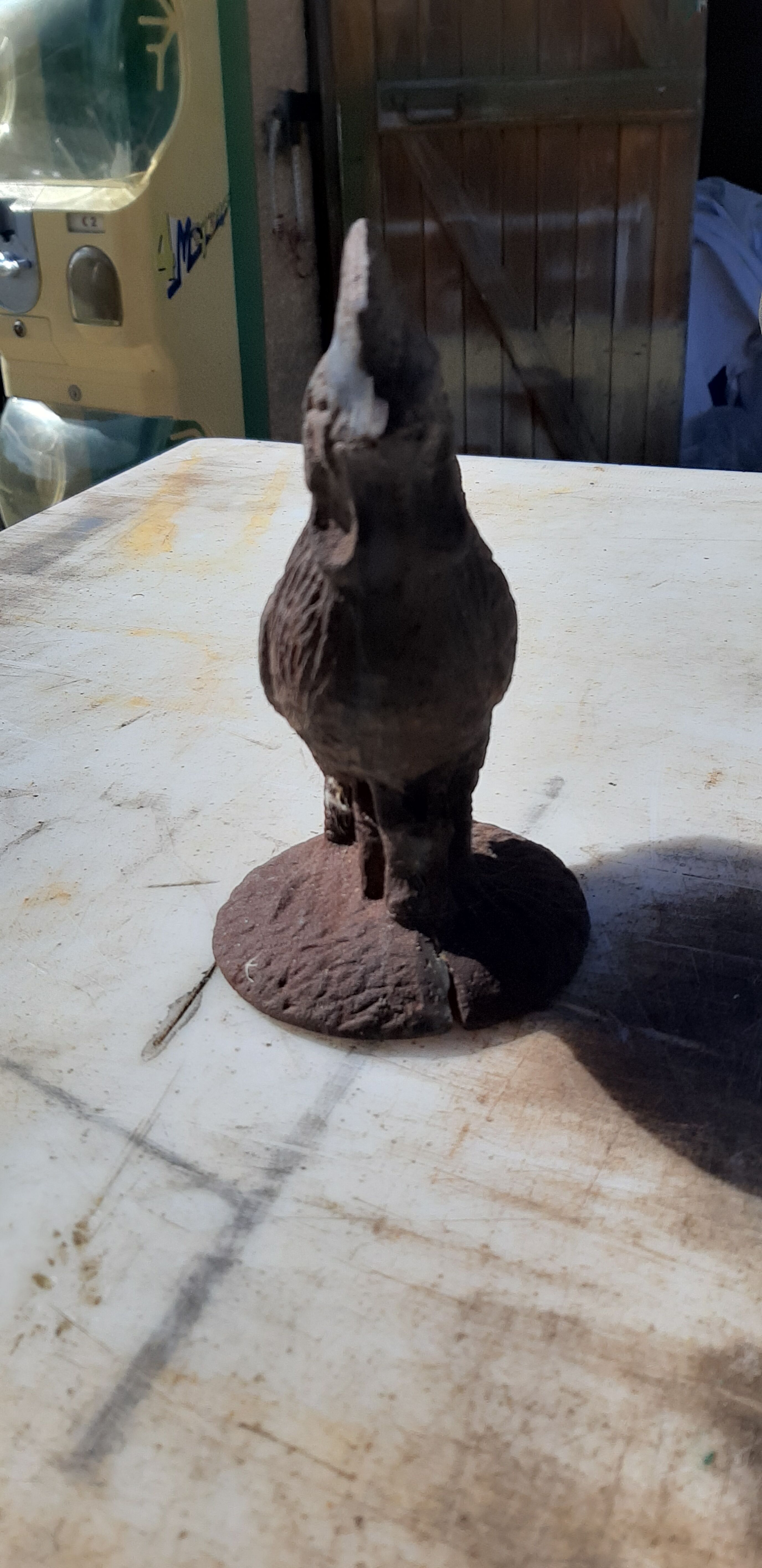 2 roosters and 2 cast iron birds