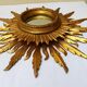 Sun mirror in carved gilded wood from the 1950s