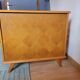 Vintage baby cot with splayed legs.