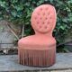 Fauteuil crapaud capitonné rose vintage