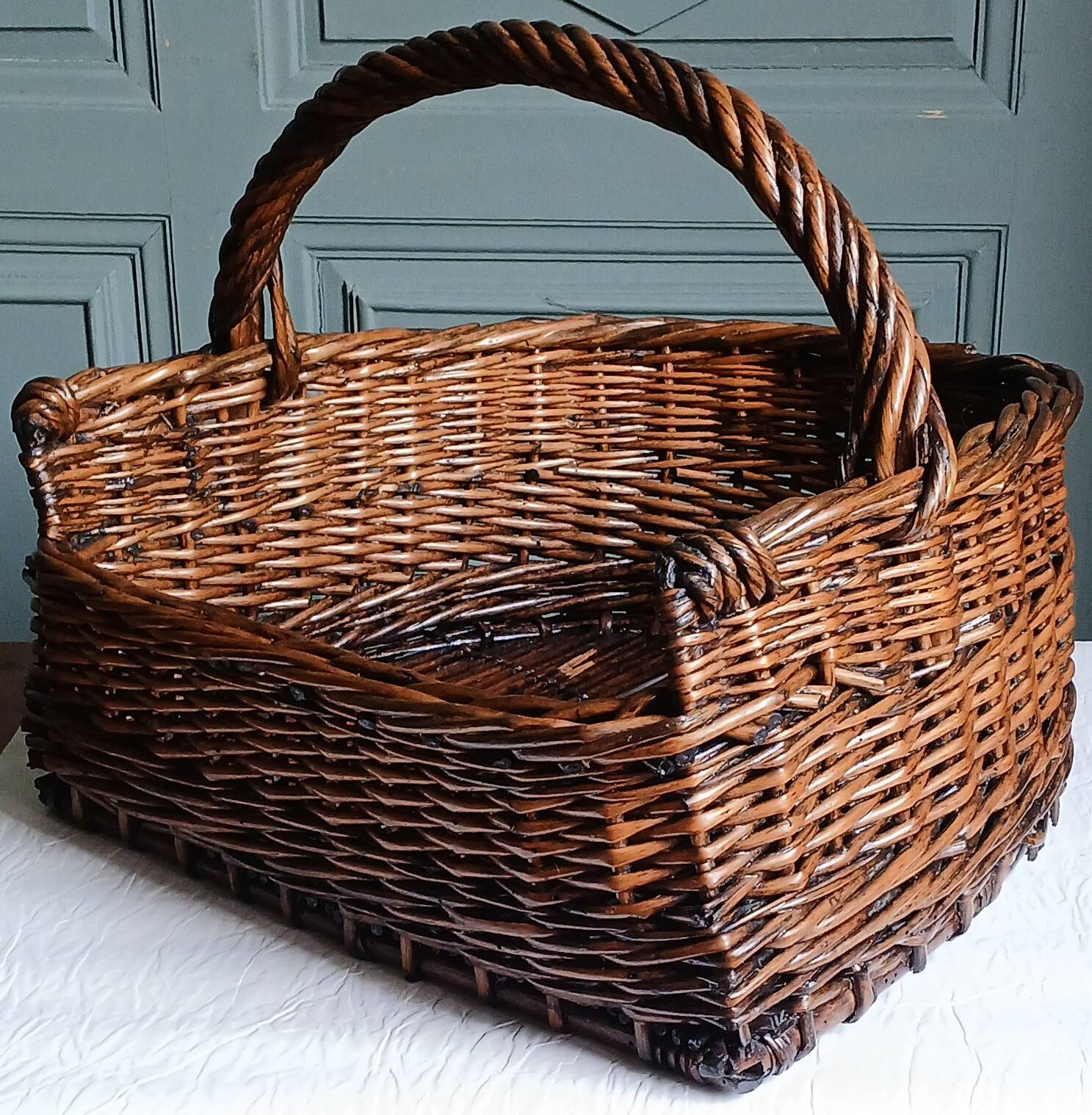 Handmade woven and dyed willow harvest basket.