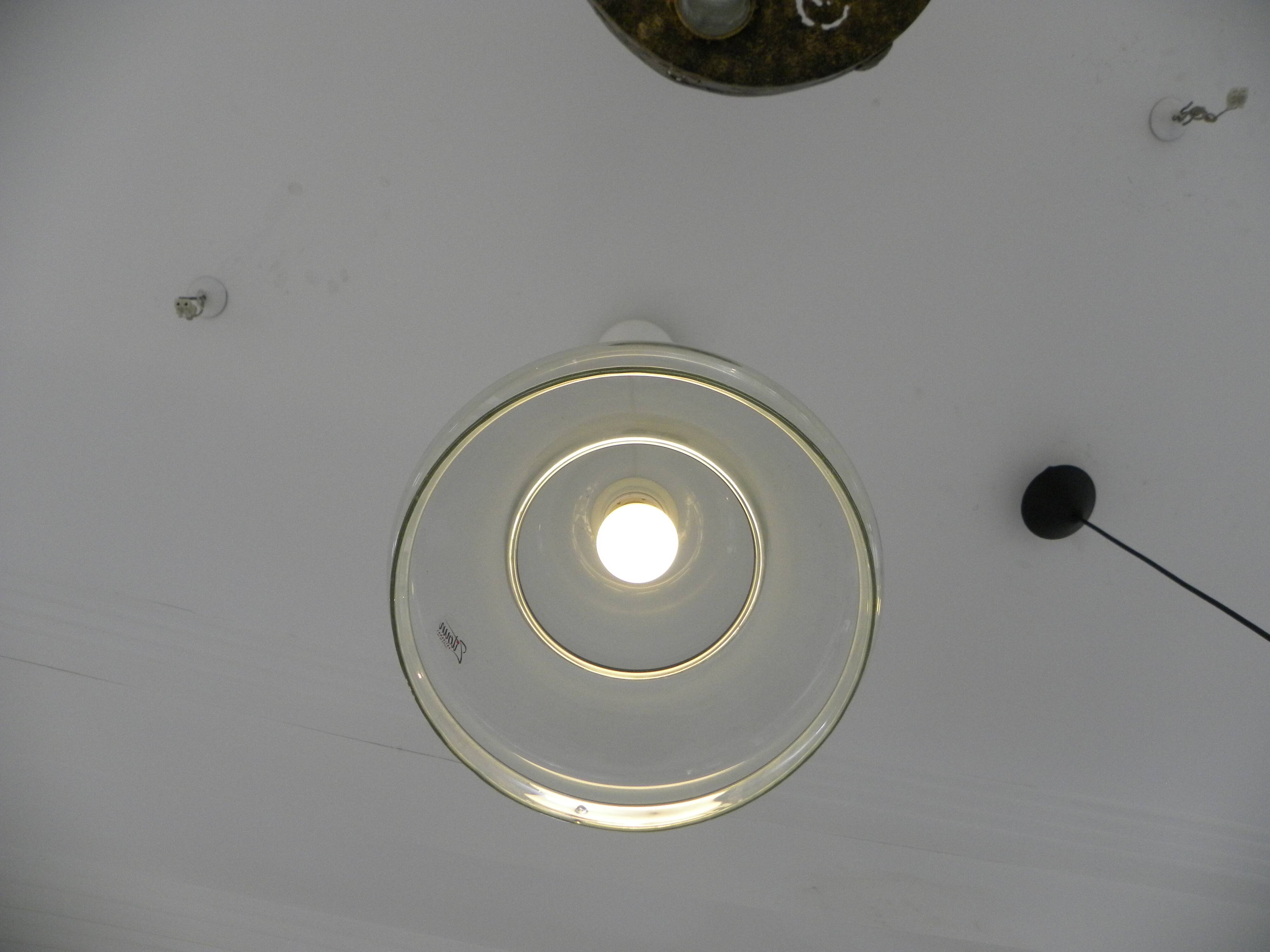 Suspended lamp in transparent blown glass, modern, minimalist, timeless style.