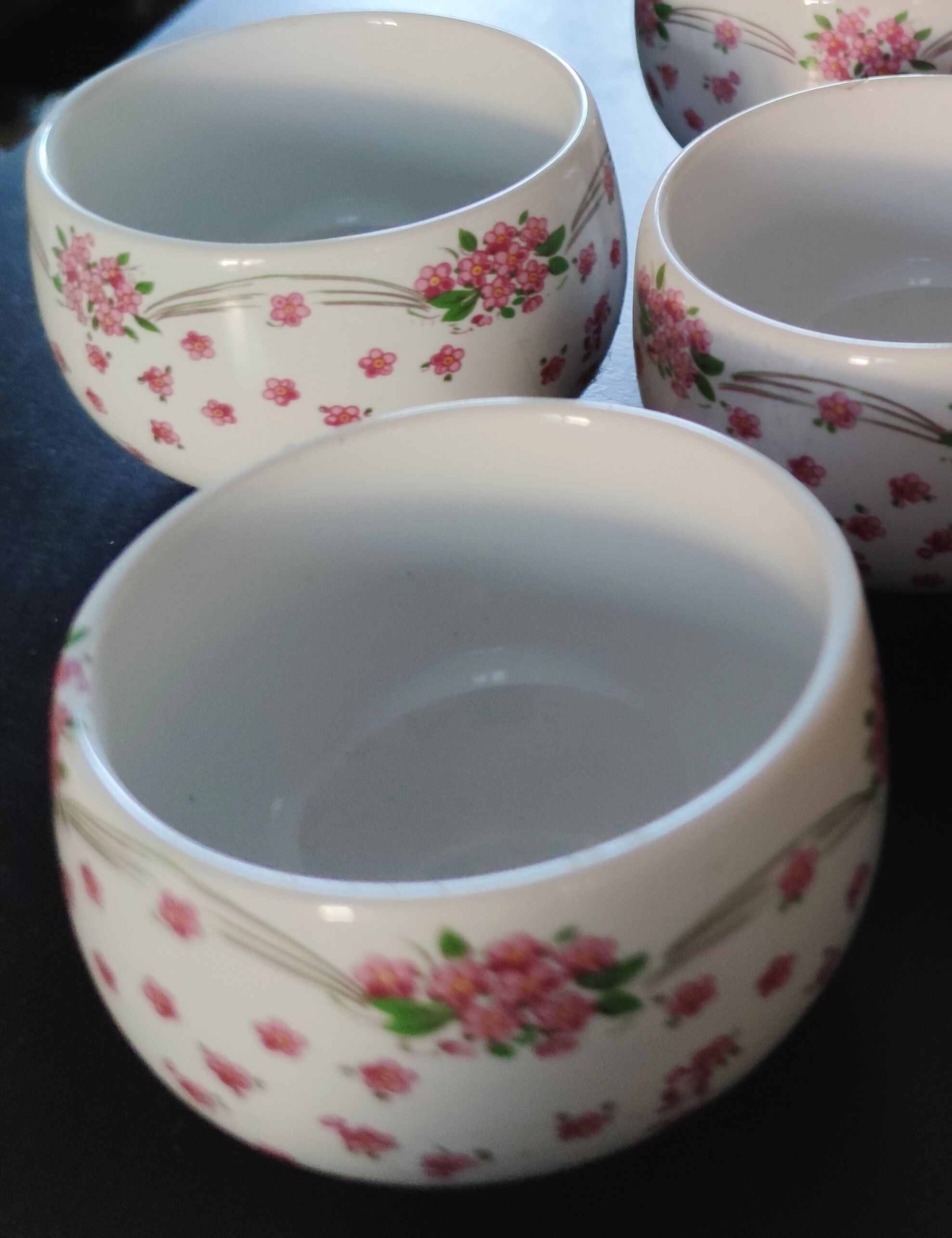 Service of small six cups for tea, cream, fruit salad or coffee